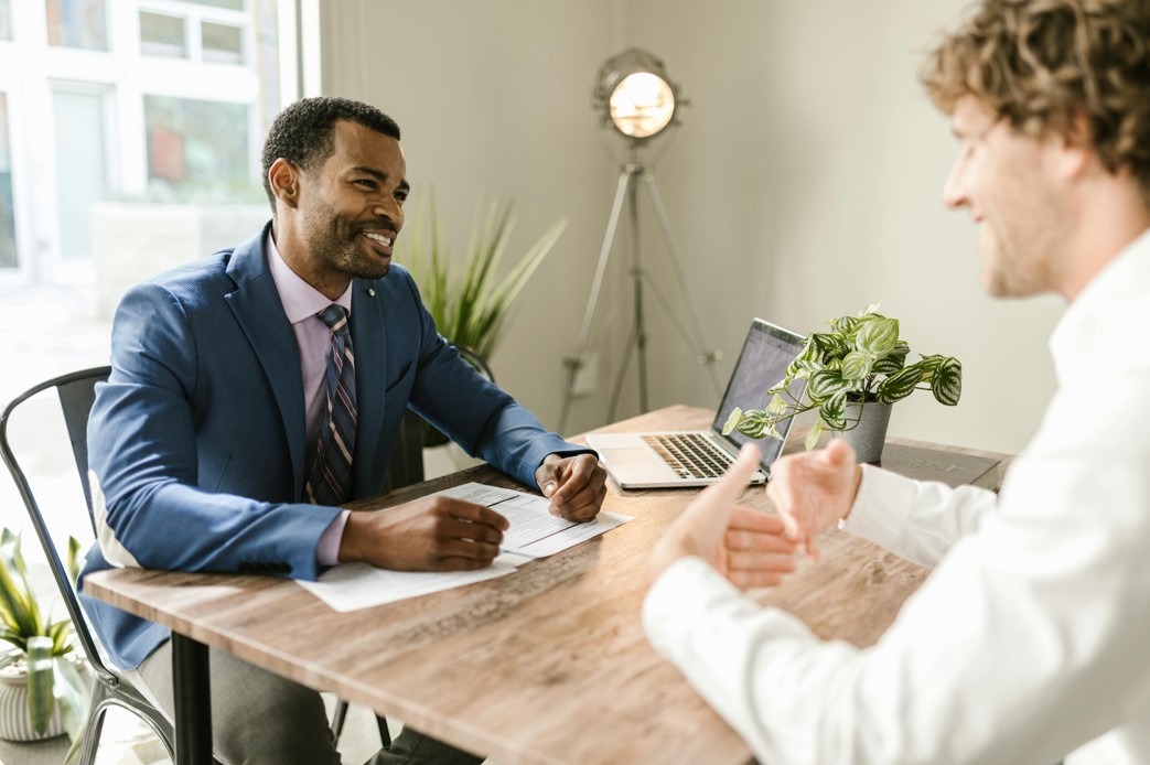 An agent is explaining a life insurance policy to a client